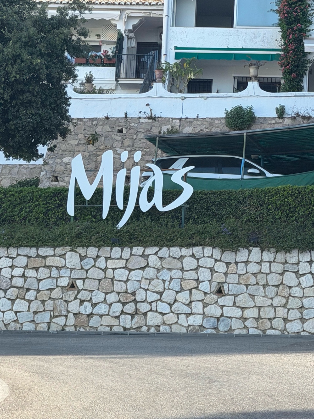The Mijas sign on a stone wall