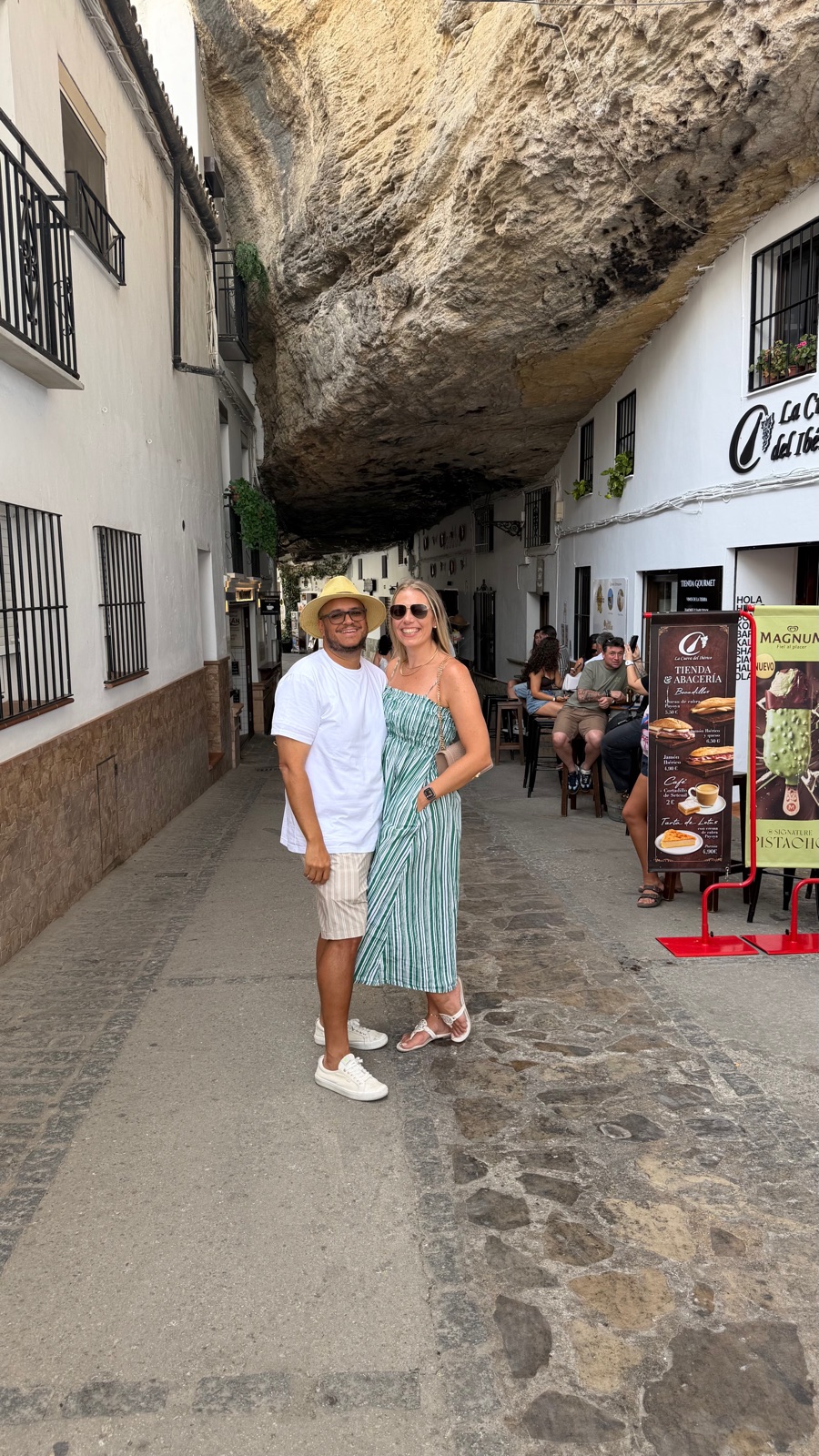 Miguel and Ashley standing under the rock overhang in Setenil