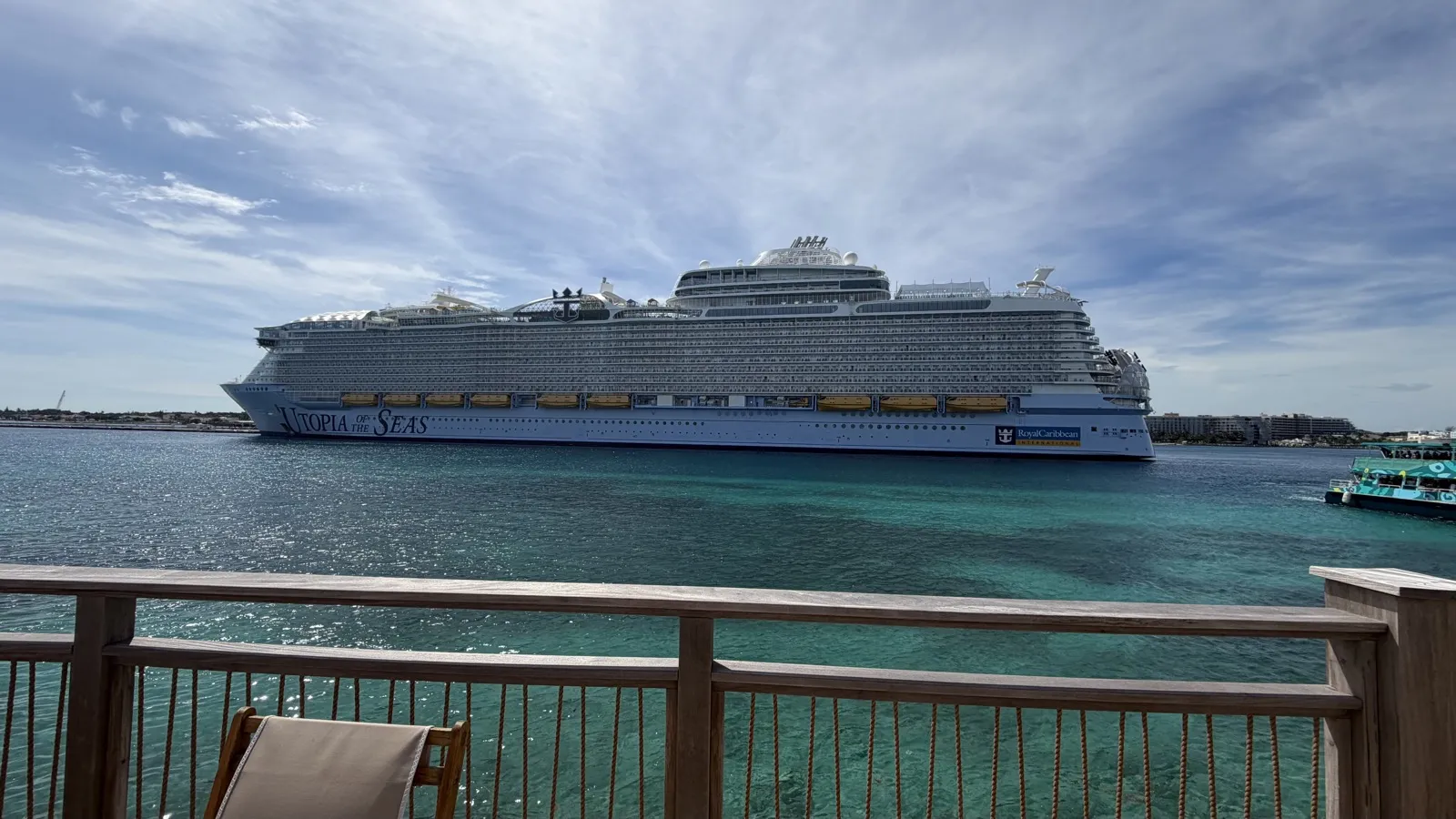 Utopia of the Seas docked in Nassau, seen from a deck at Royal Beach Club