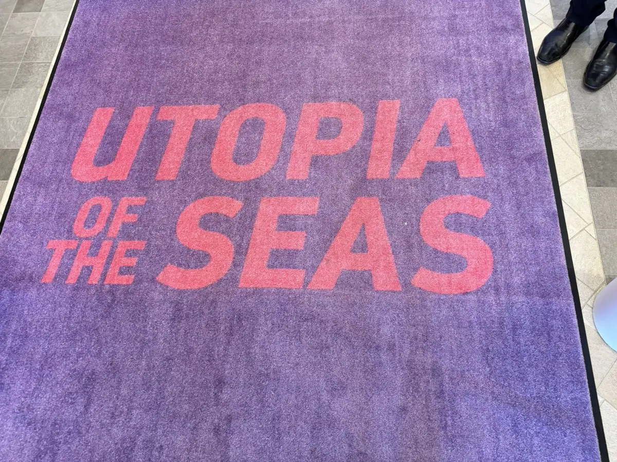 Purple Utopia of the Seas welcome mat at the boarding entrance