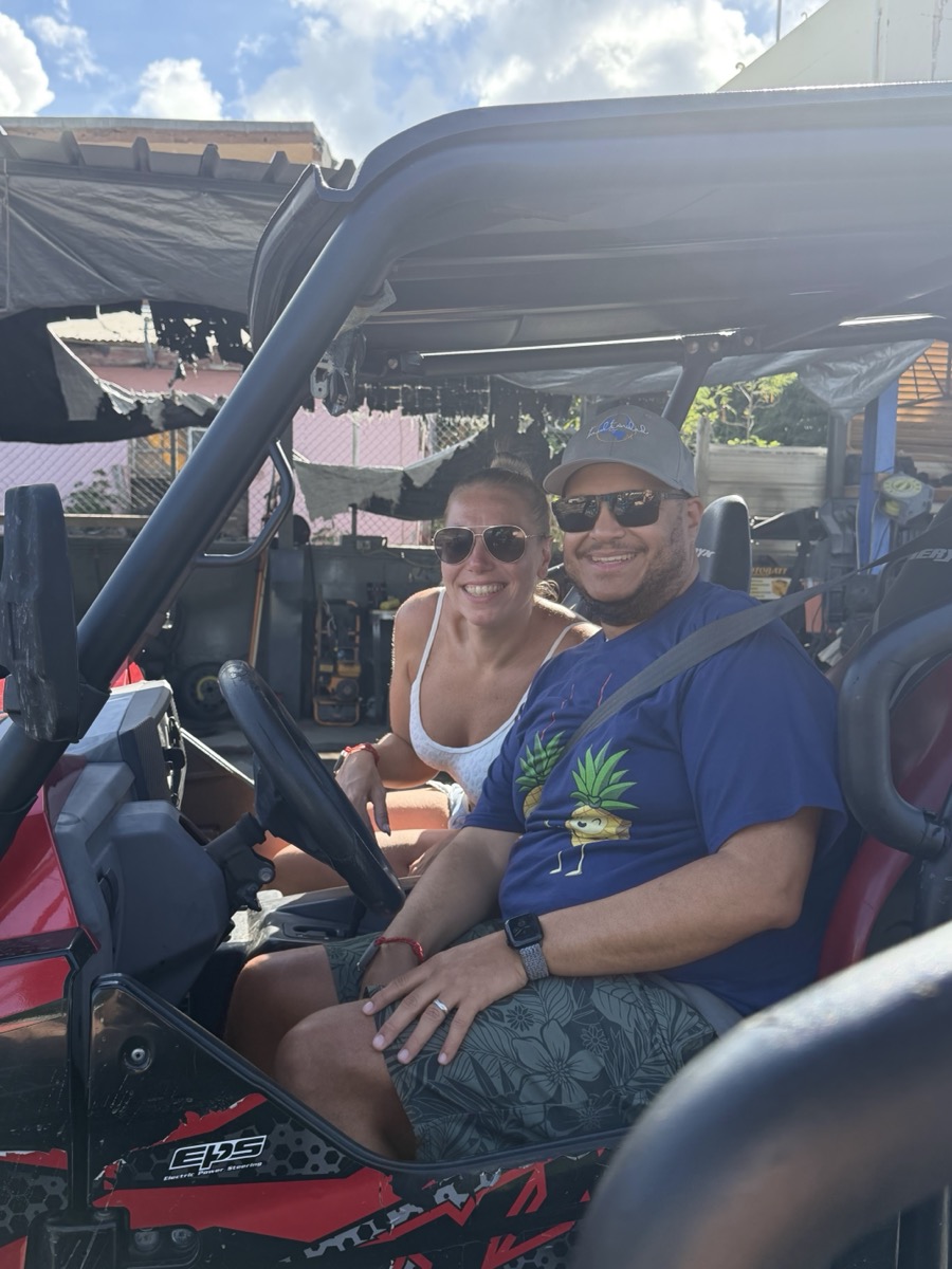 Miguel and Ashley in a dune buggy on a Caribbean shore day from Valiant Lady