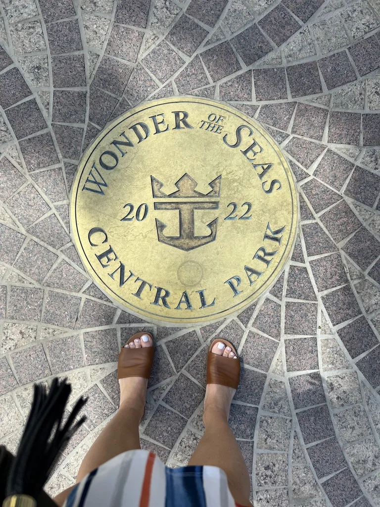Brass Wonder of the Seas 2022 Central Park medallion set into the deck