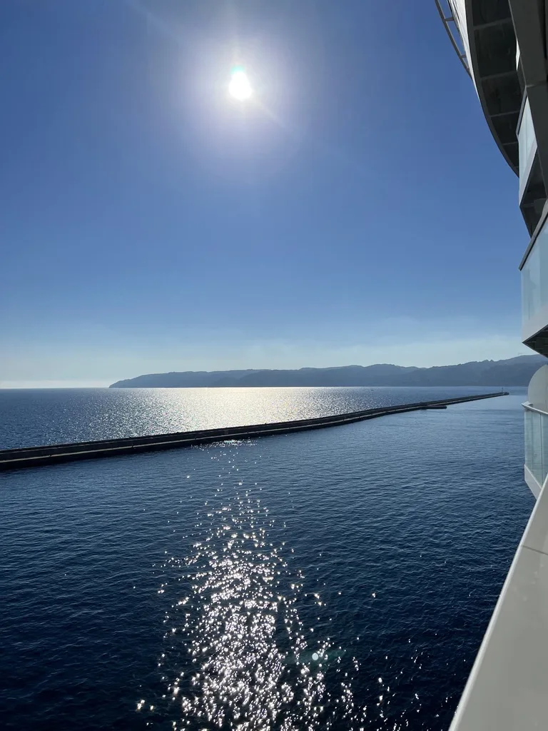 Sun over the Mediterranean seen from a balcony as Wonder of the Seas sails out of Marseille